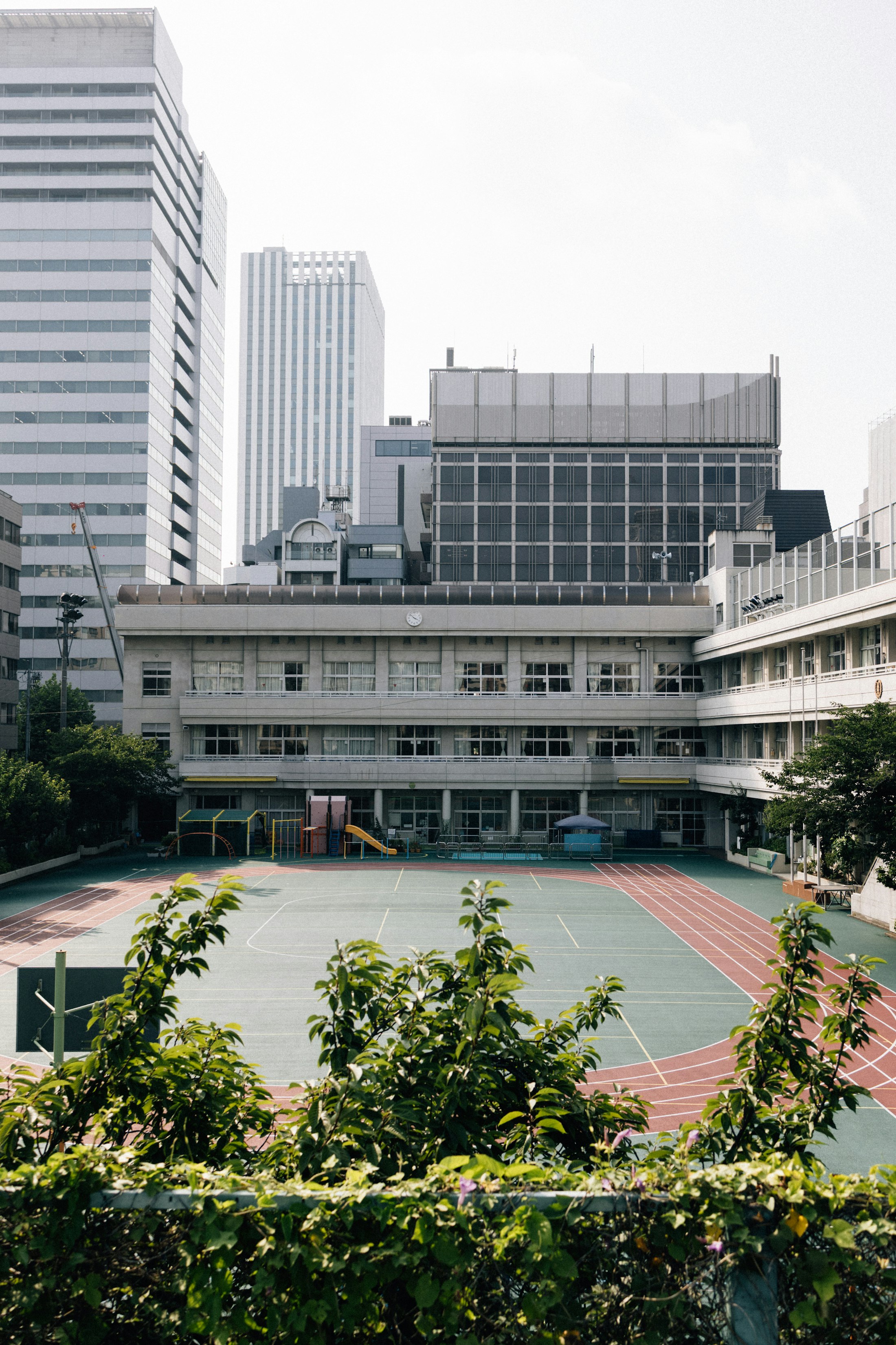 Students walking and running on a school track during daily activity period