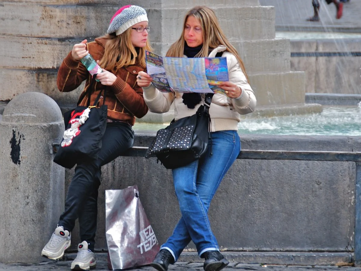 Travelers reading a city map to represent the explorer persona