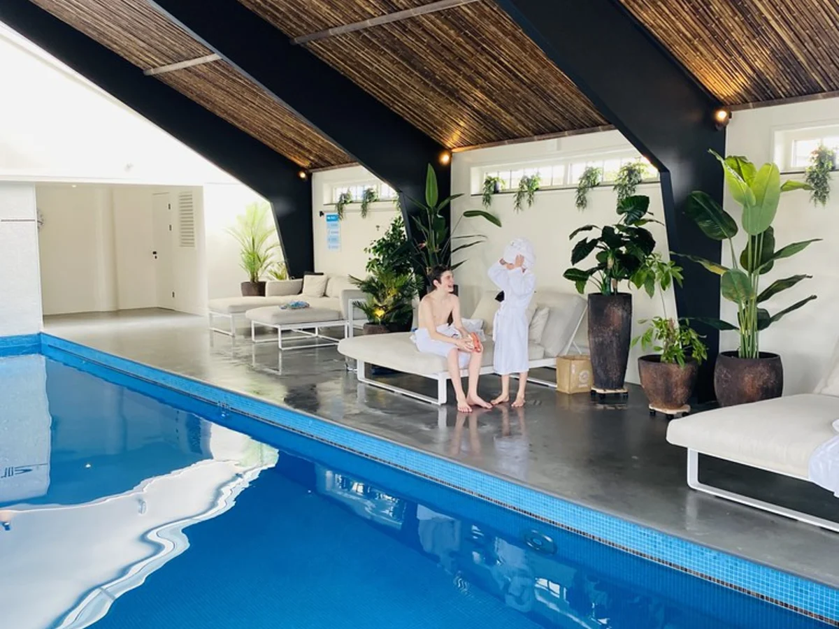 Guests enjoying an indoor resort pool to represent staycation persona